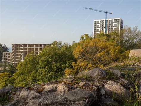 Premium Photo | Construction of a modern house next to the ancient