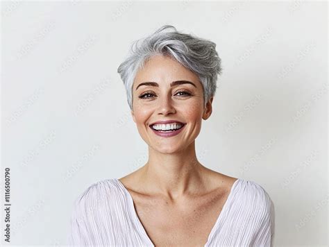 Joyful Mature Woman With Short Gray Hair Smiling Brightly Standing