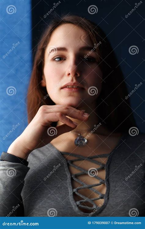 Portrait Of The Pretty Brunette Girl With Hands Near The Face Stock