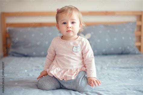 Baby With Dirty Blonde Hair And Blue Eyes