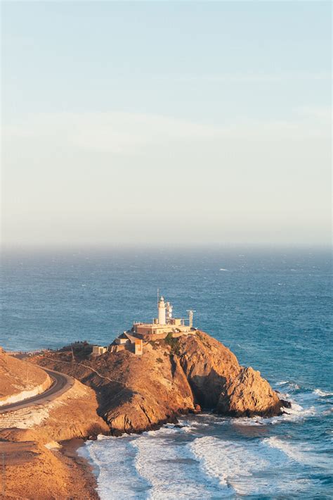 Lighthouse In The Mediterranean Sea By Stocksy Contributor ACALU