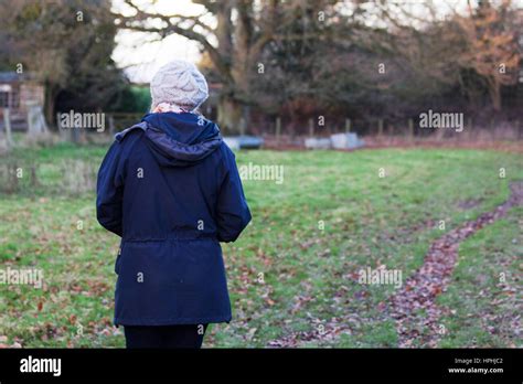 Beautiful Mature Woman Out Walking In The Countryside Stock Photo Alamy