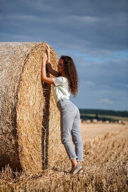Premium Photo Beautiful Girl Near Hay Bales In The Countryside Girl
