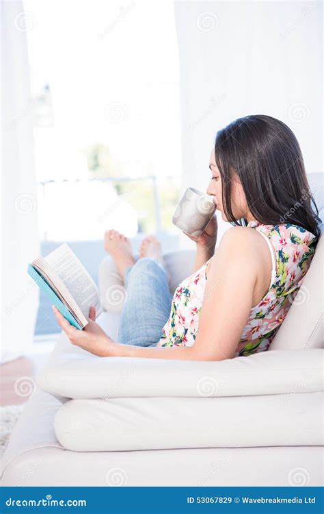 Pretty Brunette Reading A Book On Couch Stock Image Image Of Hair Home