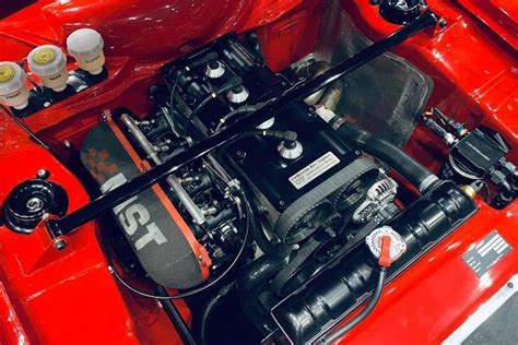 The Engine Compartment Of An Old Red Car