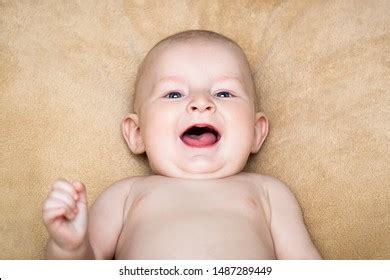Smiling Naked Baby On Beige Background Stock Photo Shutterstock