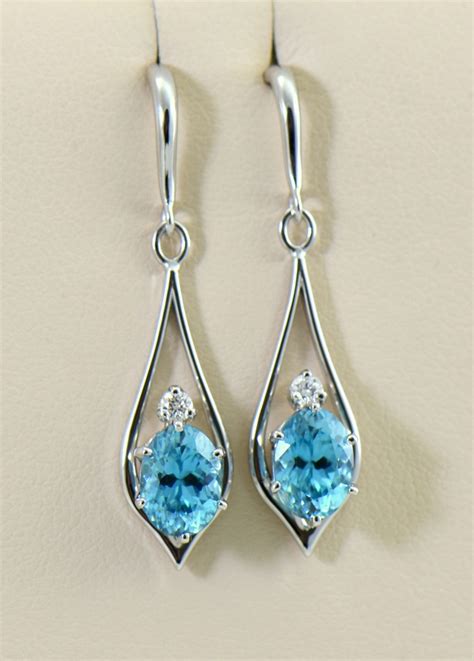 Natural Blue Zircon And Diamond Earrings In White Gold