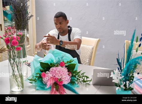 Focused Florist Winding Ribbon On Flower Bouquet Stock Photo Alamy