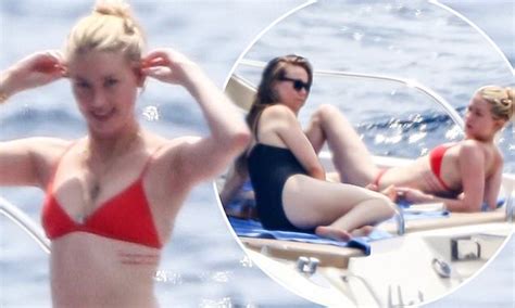 Amber Heard Showcases Her Incredible Figure In A Tiny Red Bikini On A Yacht In The Amalfi Coast