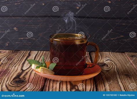 Cup Of Tea On A Wooden Background With Autumn Leaves Stock Photo