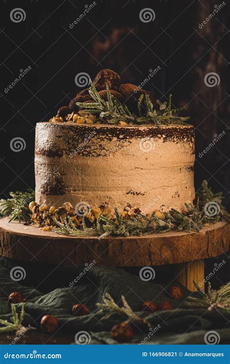 Delicious Naked Chocolate And Hazelnuts Cake On Table Rustic Wood Kitchen Countertop Stock Image