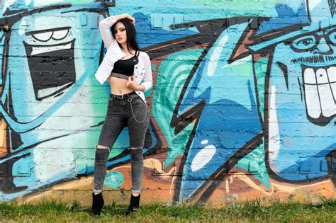 Graffiti Wall Grass Brunette Girl Pose Jacket Legs Jeans Hd Wallpaper Rare Gallery