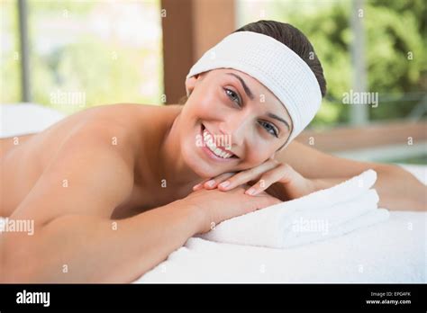 Beautiful Smiling Brunette Lying On Massage Table Stock Photo Alamy