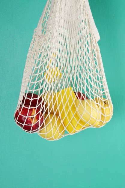 Premium Photo Reusable Shopping Mesh Bag With Lemons Fruits And