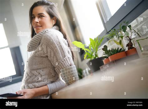 Brunette Girl With Long Hair Talking On Phone With Earphones Stock Photo Alamy