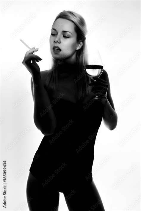 Beautiful Blonde Girl In Black Body And Heels With Visible Shadow Stock