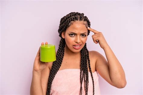 Premium Photo Afro Black Woman Feeling Confused And Puzzled Showing