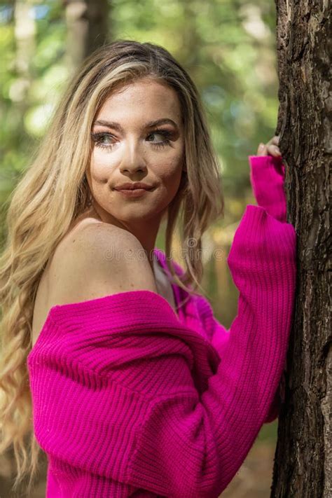 A Lovely Blonde Model In Western Gear Poses Outdoor While Enjoying The Spring Weather Stock