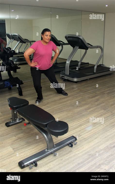 Year Old Latina Woman Stretches To Exercise At The Gym To Improve Her Health And Avoid