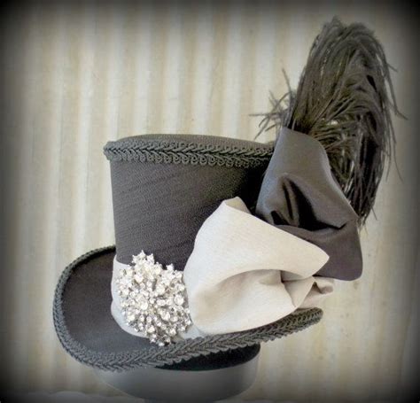 A Top Hat With Feathers And Beads On It