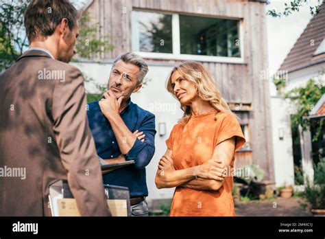 Mature Couple Having Discussion With Real Estate Agent Stock Photo Alamy