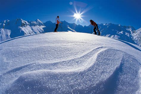 Skiers On Top Of The Mountain At The Ski Resort Of Solden Austria