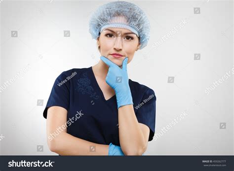 Thoughtful Nurse Nude Make Wearing Blue Stock Photo