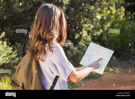 Brunette Hiker Reading Map Stock Photo Alamy