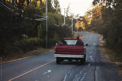 "Young Friends Enjoying Summer Road Trip Together In Old Truck" by ...