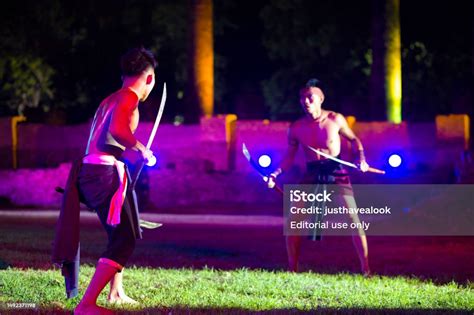 Historical Thai Sword Fighters In Fighting Position At Traditional Thai