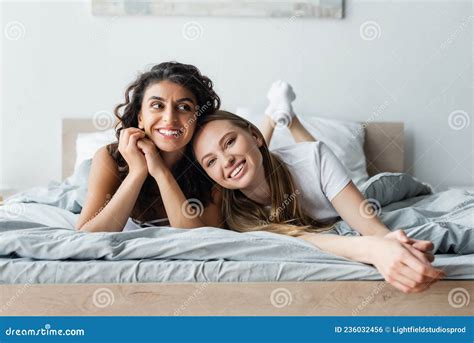 Smiling Lesbian Couple Lying On Bed Stock Photo Image Of Relax Caucasian