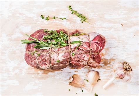 Premium Photo Raw Uncooked Roastbeef Meet Cut With Rosemary Thyme