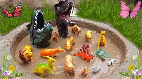 Plastic Dinosaurs Stuck In Mud Velociraptor Parasaurolophus T Rex