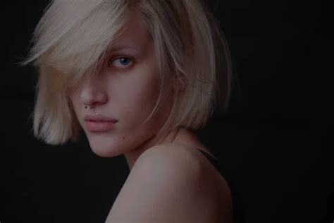 Blonde Woman Bob Hairstyle Dark Background Stock Photo By Amixstudio