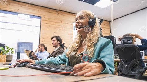 woman   call center wearing  headset smiling  working