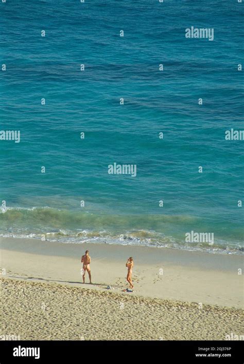 Nudist couple in the beach. Corralejo, Fuerteventura island, Canary