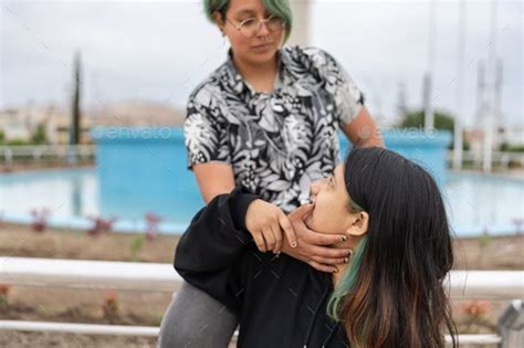 Cropped Photo Of A Lesbian Woman Caressing Her Partner S Face Stock Photo By Wirestock