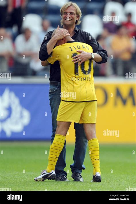 Dortmund?s head coach Juergen Klopp (back) hugs Mohamed Zidan who ...