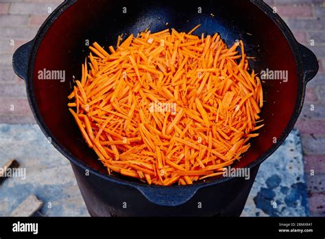 Preparation Of National Uzbek Dish Pilaf Pilaw Plov Carrot With Meat