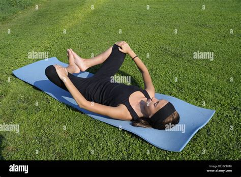 Girl Doing Advanced Stretching Exercises For The Legs And Groin With Feet Elevated Second