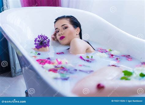 Brunette Woman Relaxing In A Hot Bath With Flowers Stock Photo Image Of Gorgeous Lady