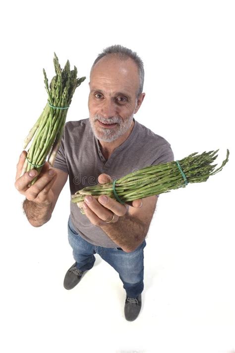 Portrait Of A Man With Asparaguson White Background Stock Image