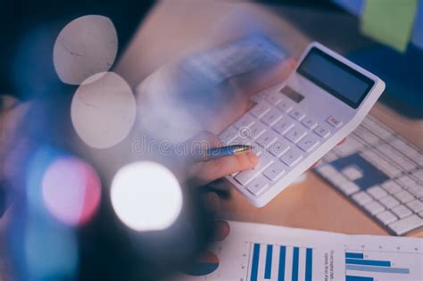 Business Accounting Concept Businessman Uses Calculator With Laptop