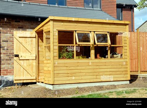 Wooden Garden Potting Shed With Windows And Door Open Stock Photo Alamy