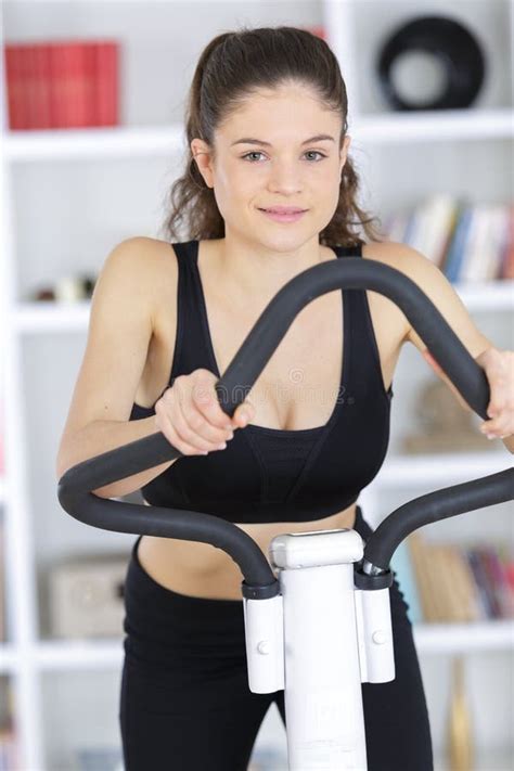 Fit Brunette Working Out On Exercise Bike Stock Image Image Of Healthy Spare