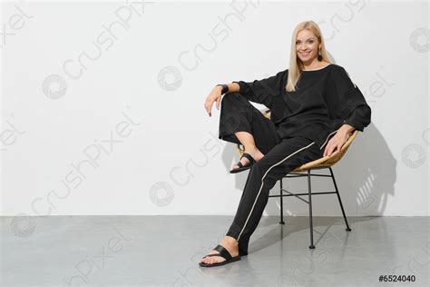 Studio Portrait Of Smiling Blonde Woman In Black Casual Clothes Stock Photo 6524040 Crushpixel