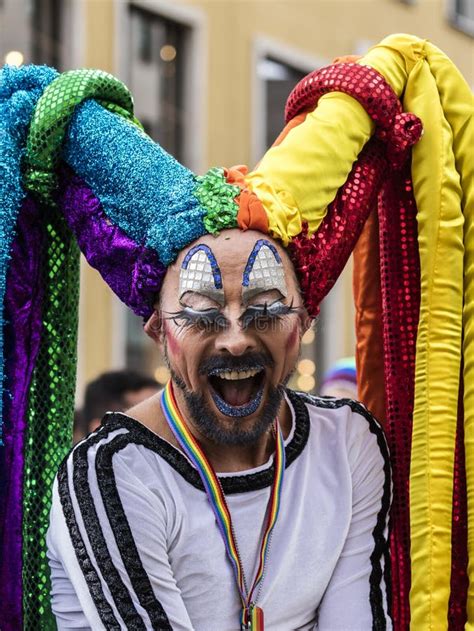 A Cheerleader Drag Queen With Large Colorful Dreadlocks Attending The Gay Pride Parade Also