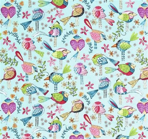 A Yellow Fabric With Colorful Birds And Flowers On The Bottom In Front