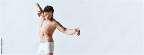 Mature Man Posing Shirtless In Underwear Against Grey Studio Background Male Model With