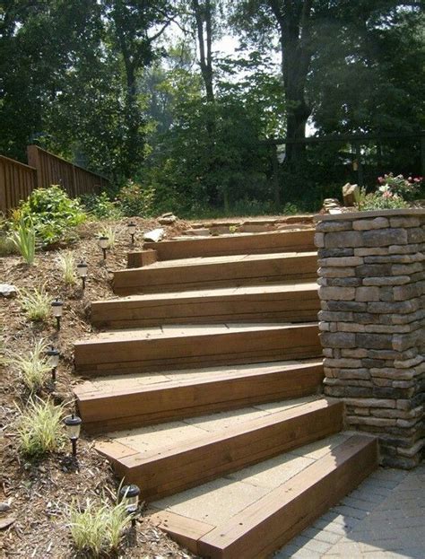 raised garden bed  wood sleepers  backyard design downhill
